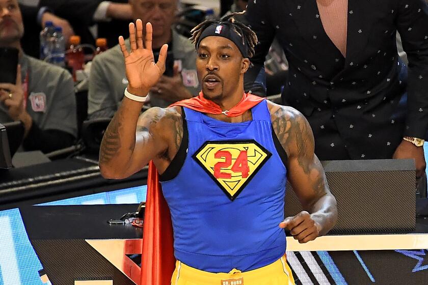 Dwight Howard dons a Superman outfit with No. 24 instead of the 'S' on his chest during the Slam Dunk Contest on Saturday.
