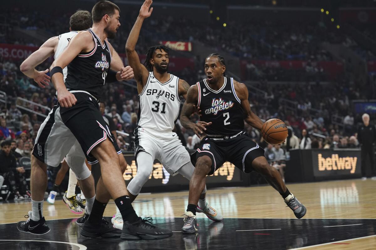 Clippers forward Kawhi Leonard drives to the basket during a win over the San Antonio Spurs.