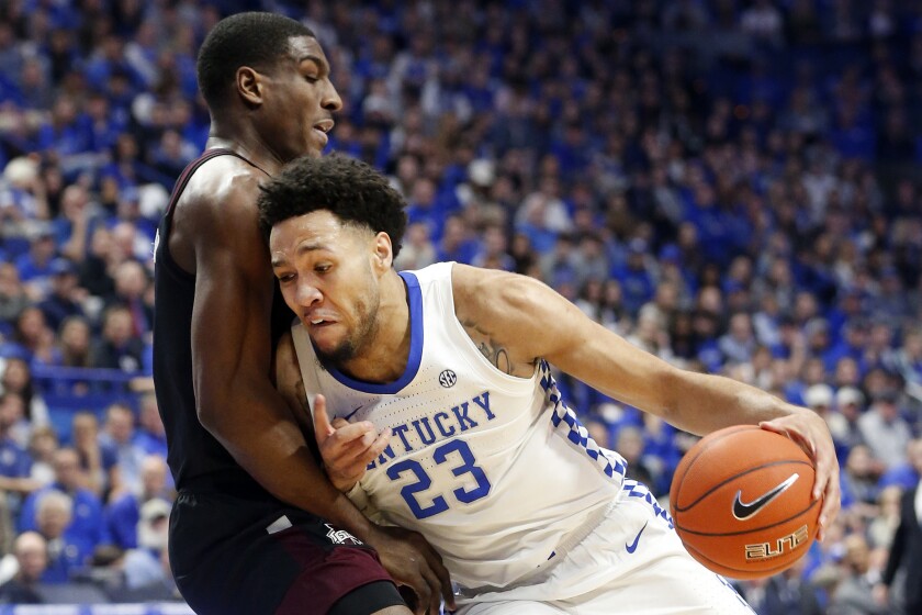 Kentucky's EJ Montgomery, right, collides with Mississippi State's Reggie Perry during the first half of an NCAA college basketball game in Lexington, Ky., Tuesday, Feb. 4, 2020. (AP Photo/James Crisp)