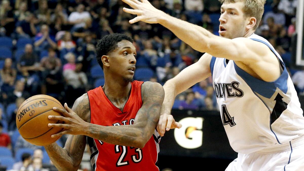Raptors guard Lou Williams (23), usually a shoot-first player, looks to pass against Timberwolves forward Robbie Hummel in a game last season.