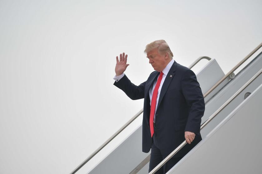 President Donald Trump steps off Air Force One upon arrival at Marine Corps Air Station Miramar in San Diego, California.