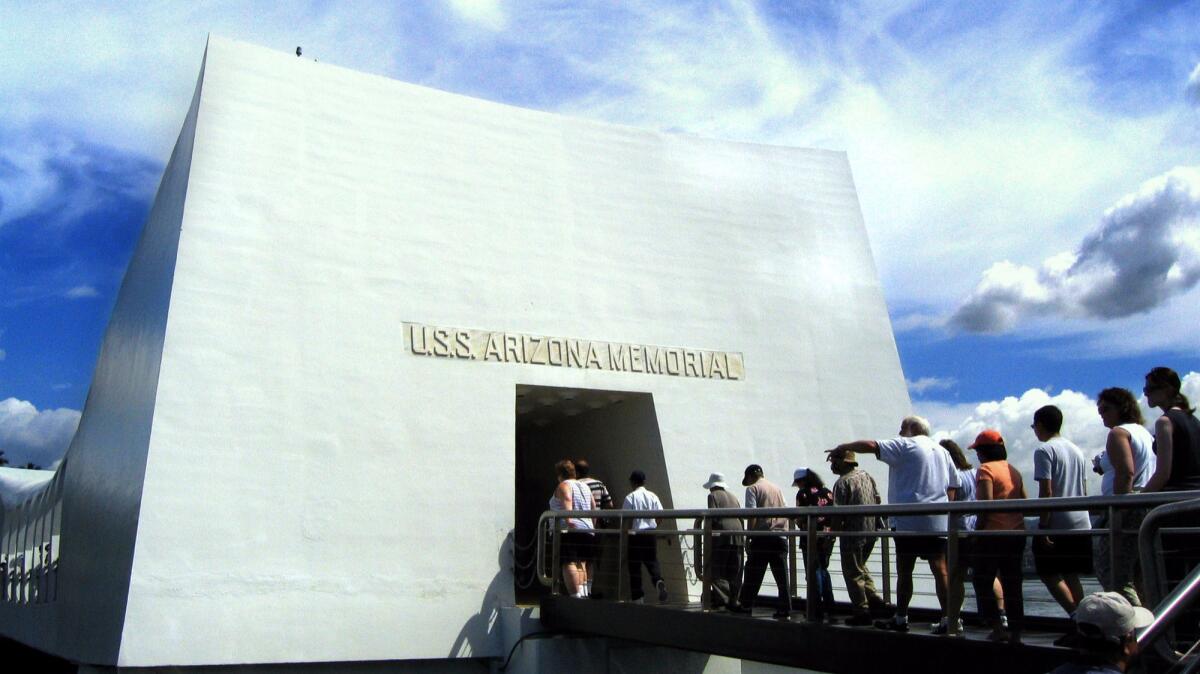 The U.S.S. Arizona Memorial pays tribute to a major site of casualties in the air raid.