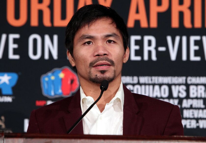 Manny Pacquiao speaks during a news conference at the Beverly Hills Hotel on Jan. 19.