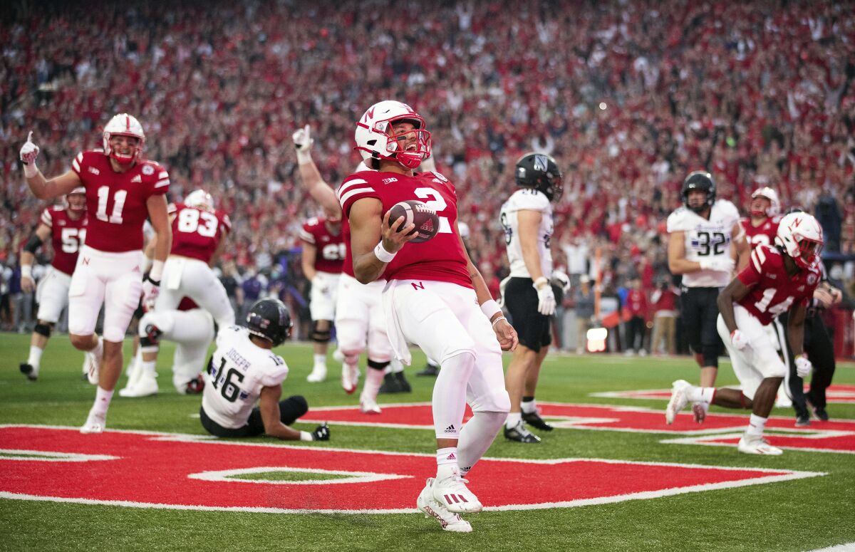 Nebraska quarterback Adrian Martinez (2) runs in for a touchdown early in the first quarter against Northwestern in an NCAA college football game, Saturday, Oct. 2, 2021, at Memorial Stadium in Lincoln, Neb. (AP Photo/Rebecca S. Gratz)