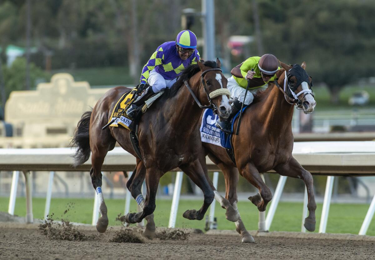 Express Train overpowers Warrant down the final stretch at Santa Anita Park.