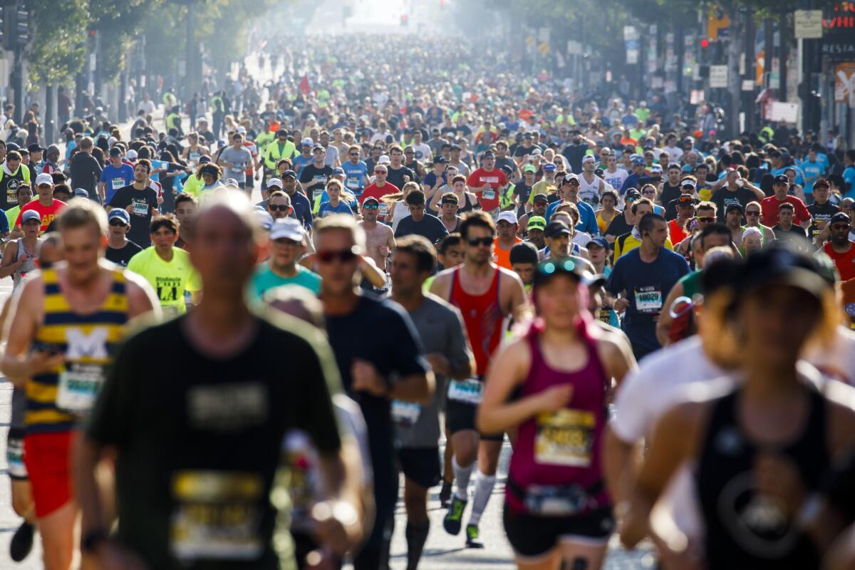 Marathon runners fill Hollywood Boulevard.