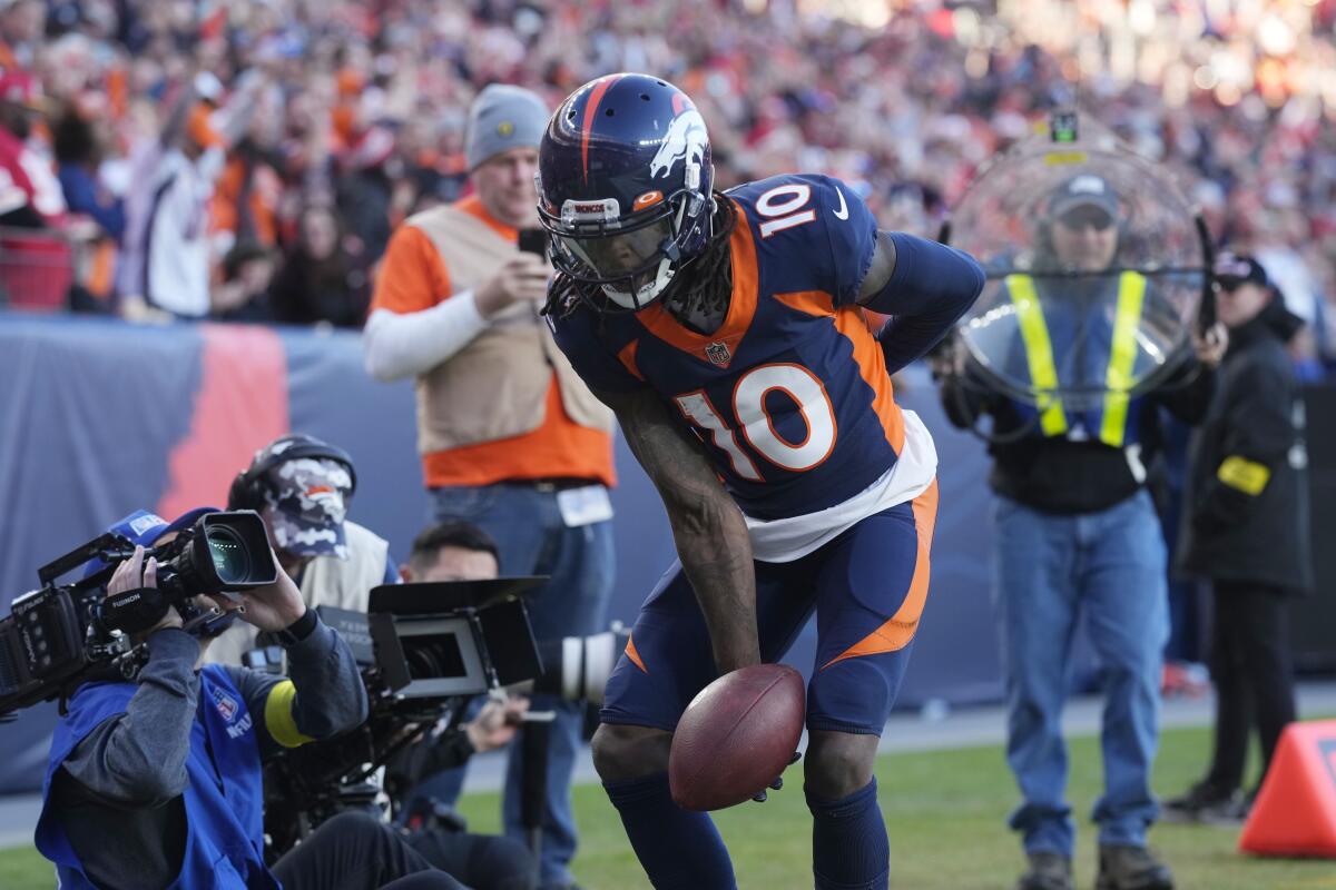 Denver Broncos wide receiver Jerry Jeudy (10) celebrates his touchdown catch during the first half of an NFL football game against the Kansas City Chiefs Sunday, Dec. 11, 2022, in Denver. (AP Photo/David Zalubowski)