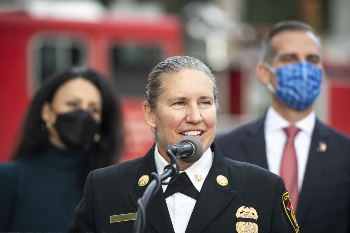 Kristin Crowley, the highest ranking woman in the LAFD, speaks to the press after Los Angeles Mayor Eric Garcetti and City Council President Nury Martinez nominated Crowley for chief of the Los Angeles Fire Department on Tuesday, Jan. 18, 2022. She would be the first female fire chief to lead the department. (Sarah Reingewirtz/The Orange County Register via AP)