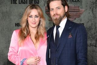 Ashley Johnson and Brian W. Foster at the Los Angeles premiere of HBO's original series "The Last of Us" held at Regency Village Theater on January 9, 2023 in Los Angeles, California.