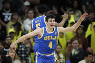 UCLA guards Jaime Jaquez Jr., front, and Chris Smith celebrate at the end of the team's NCAA college basketball game against Colorado on Saturday, Feb. 22, 2020, in Boulder, Colo. UCLA won 70-63. (AP Photo/David Zalubowski)