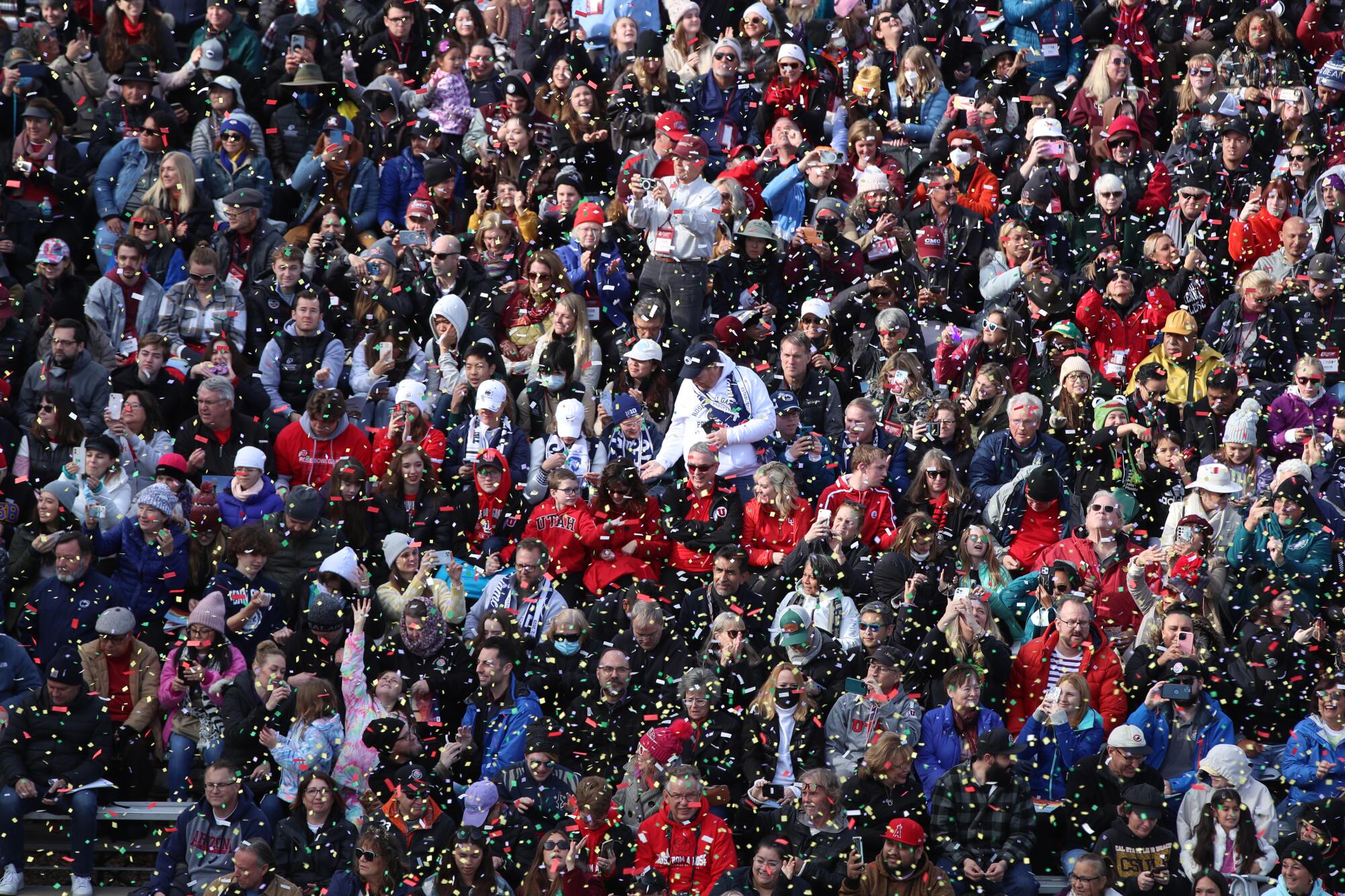 Confetti falls on the crowd at the Rose Parade.