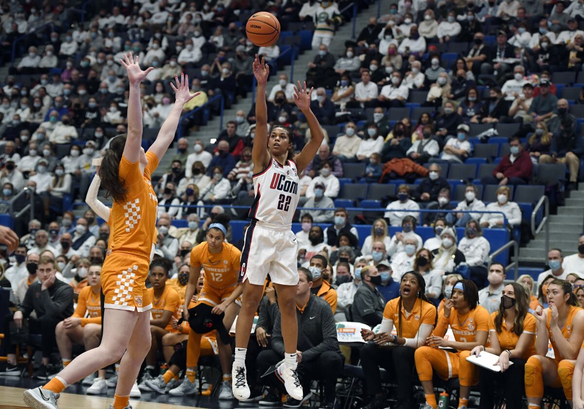 Connecticut's Evina Westbrook shoots over Tennessee's Sara Puckett (1) in the first half of an NCAA college basketball game, Sunday, Feb. 6, 2022, in Hartford, Conn. (AP Photo/Jessica Hill)