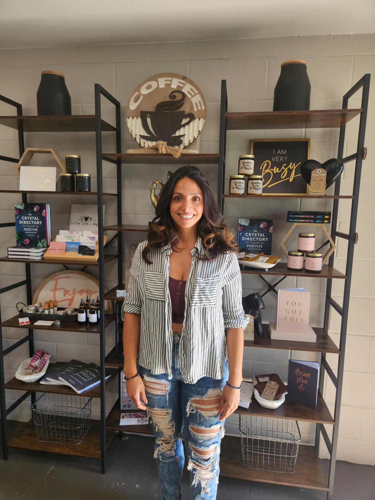 Carene Bauza, owner of CLM Tee Shop in the boutique shop area of her new brick and motar store.