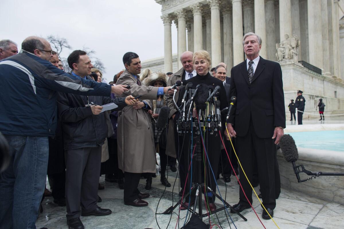 Douglas Hurst (right), the plaintiff in the second case before the Supreme Court to challenge the Affordable Care Act, and his wife Pamela speak outside the Supreme Court after oral arguments March 4.