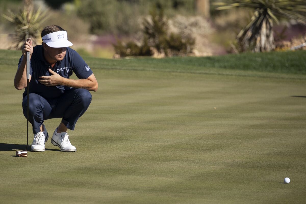 Keith Mitchell prepares to putt on the eighth hole during the second round of the CJ Cup golf tournament at the Summit Club in Las Vegas, Friday, Oct. 15, 2021. (Erik Verduzco/Las Vegas Review-Journal via AP)