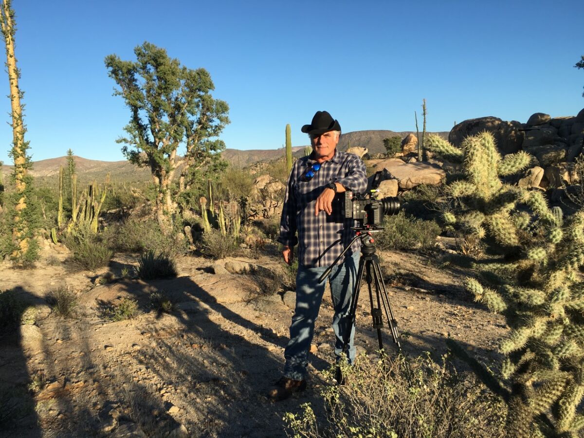 Film producer Isaac Artenstein in the Baja California desert filming a documentary on the journeys of Harry Crosby.