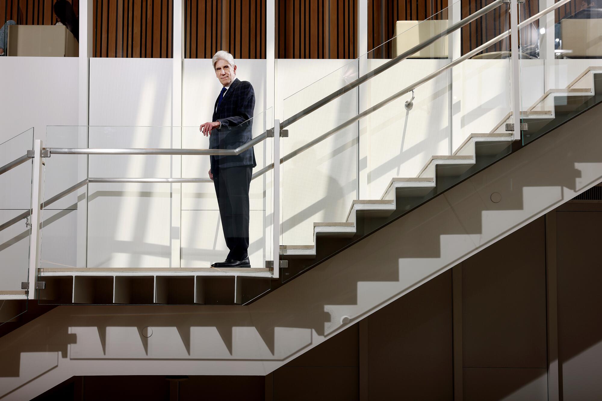 UCLA Chancellor Julio Frenk on a staircase at UCLA's Anderson School of Management.