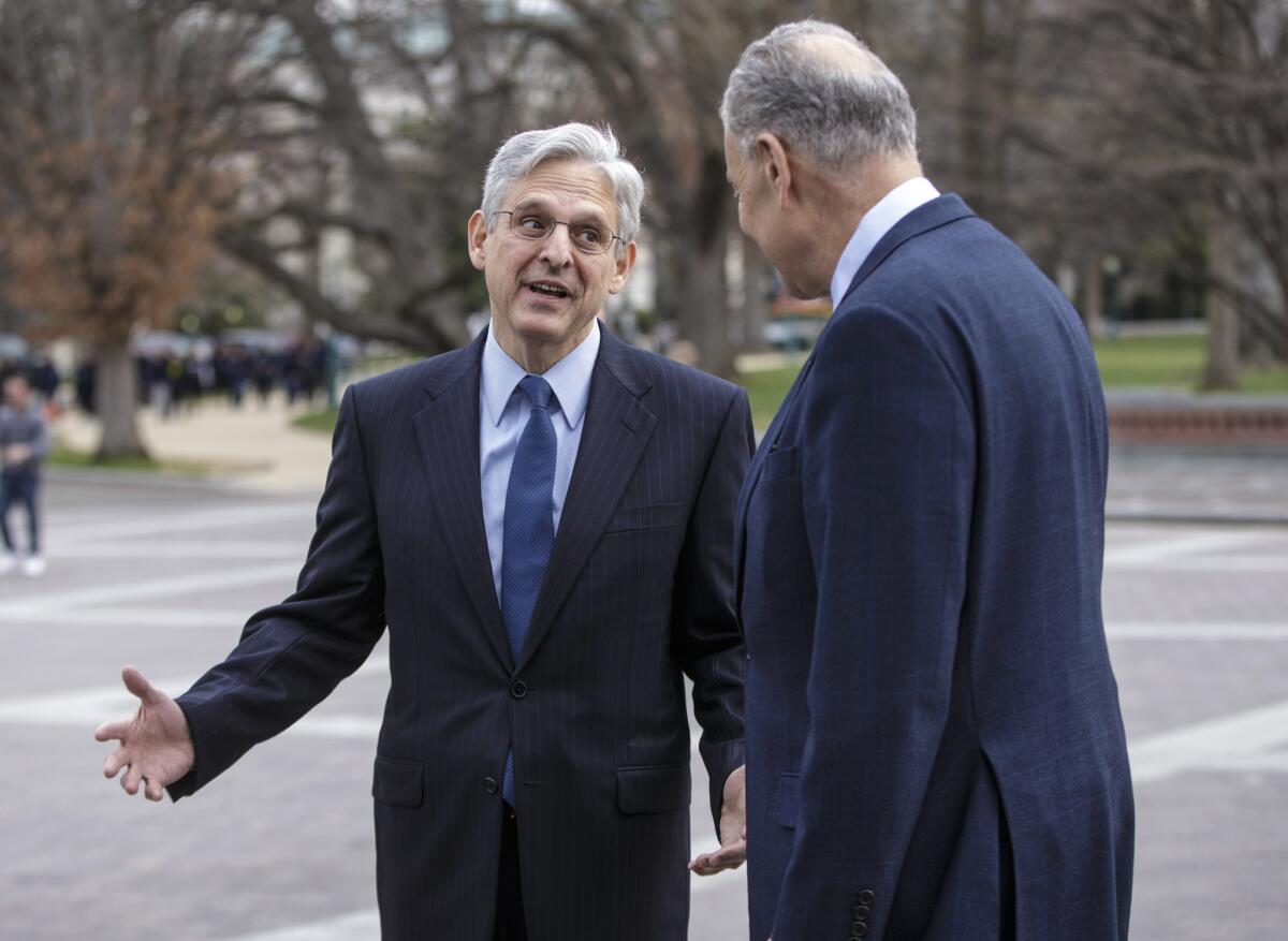 Federal appeals court Judge Merrick Garland, President Obama’s choice to replace the late Justice Antonin Scalia on the Supreme Court, talks with Senate Judiciary Committee member Sen. Charles Schumer (D-N.Y.) on Capitol Hill on March 22.