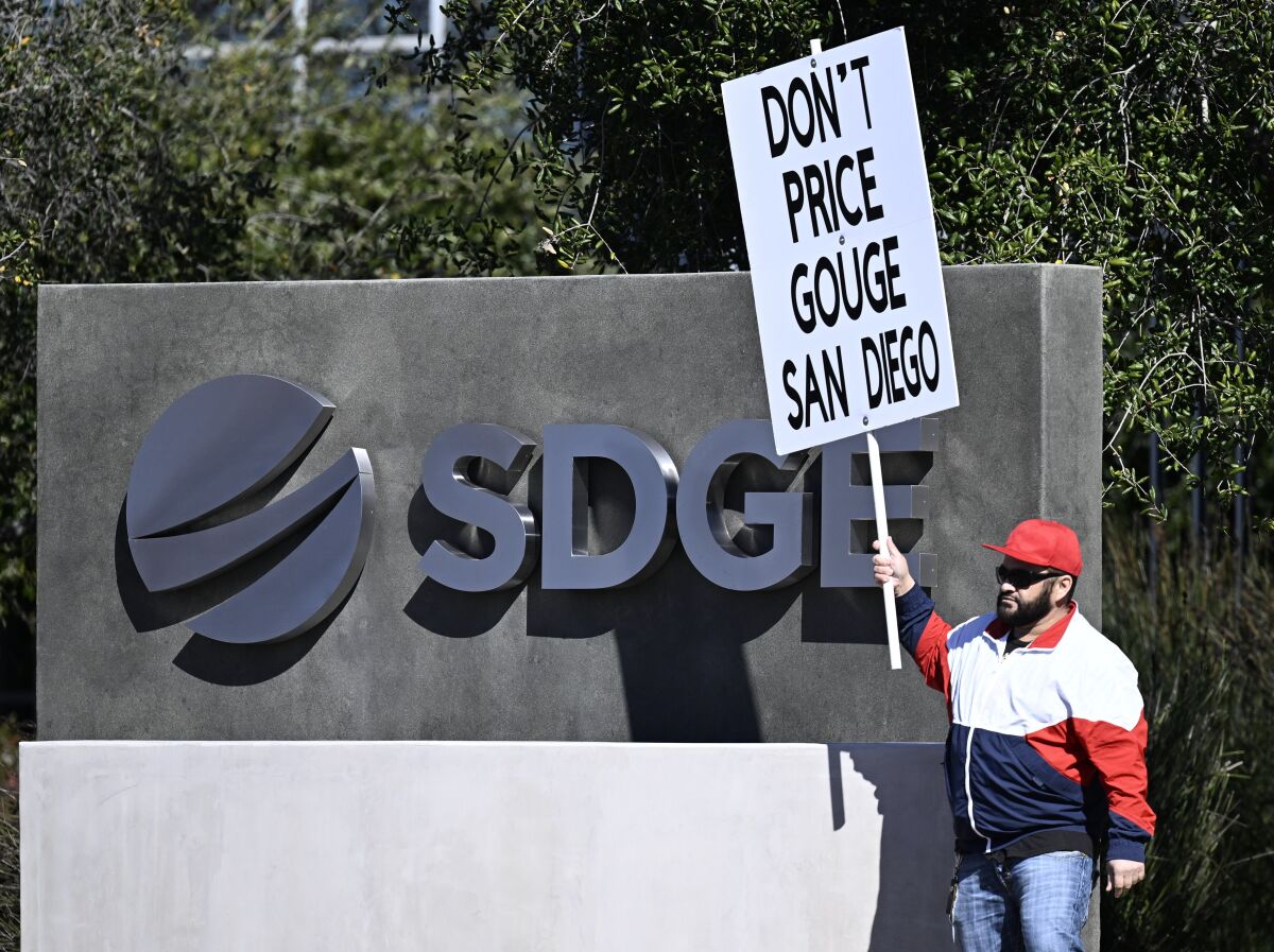 Bibian Harrison protests in front of SDG&E headquarters in February. 