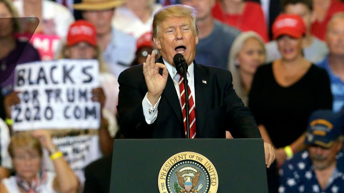 President Trump speaks at his rally in Phoenix on Tuesday, which drove Berkeley professor Dan Kammen to resign from a State Department post.