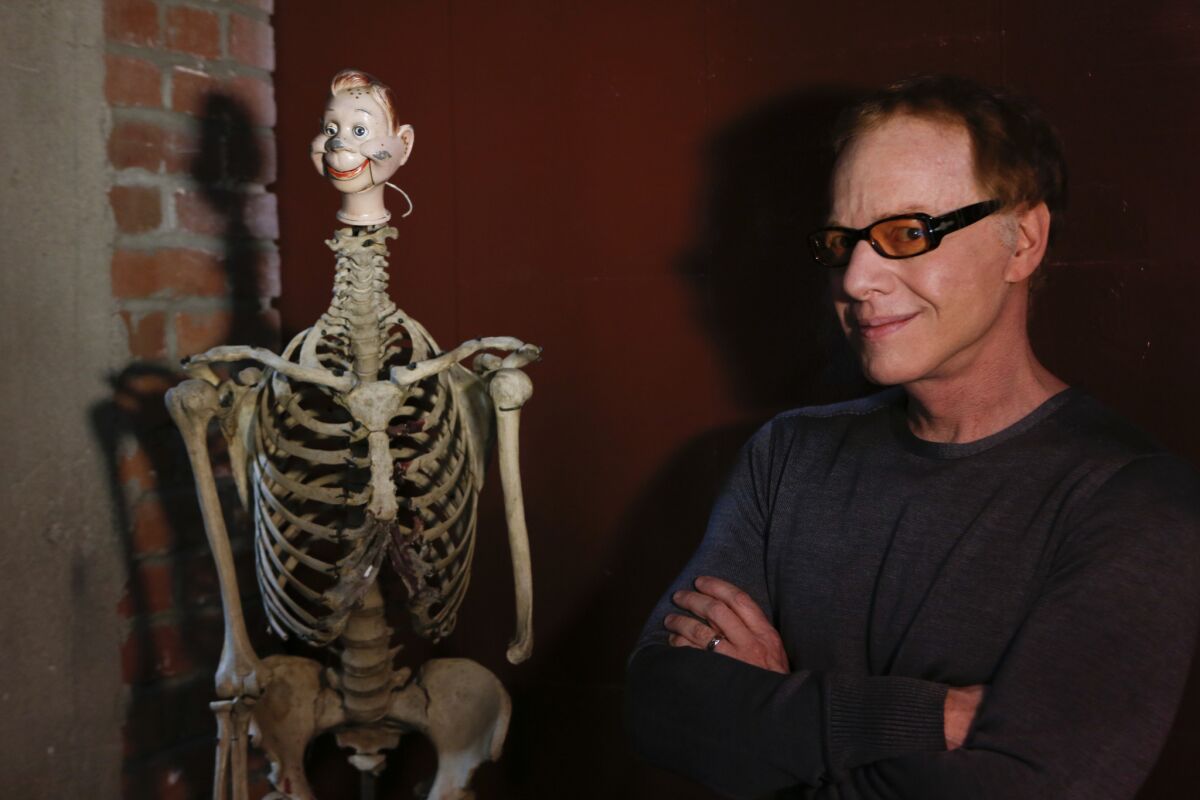 Composer Danny Elfman, shown at his studio in Los Angeles in 2013, is bringing back his Halloween orchestral concerts of music from the movies of Tim Burton.