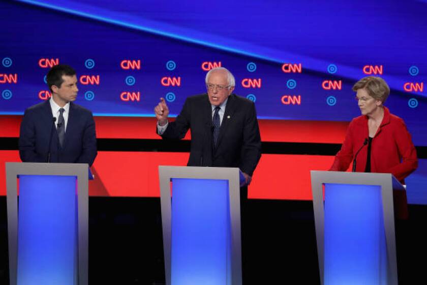 Democratic presidential candidates Pete Buttigieg, left, Bernie Sanders and Elizabeth Warren at July debate