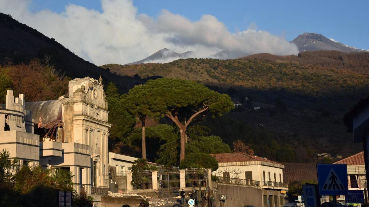 The facade of a church in Fleri, Italy, at the foot of the Mt. Etna volcano, shows damage after an earthquake hit the village on Dec. 26.