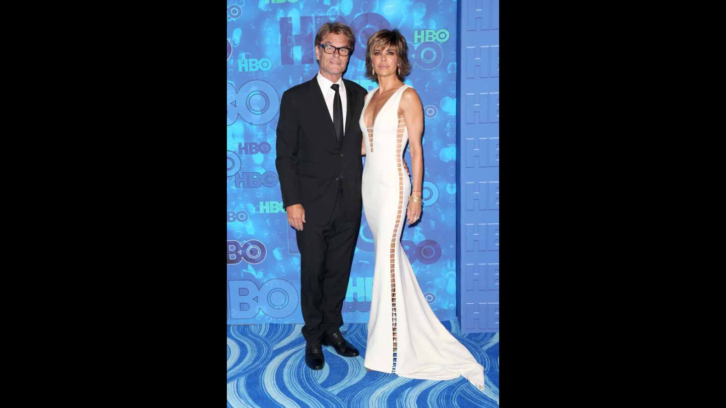 Actors Harry Hamlin, left, and Lisa Rinna attend HBO's Emmys after-party.
