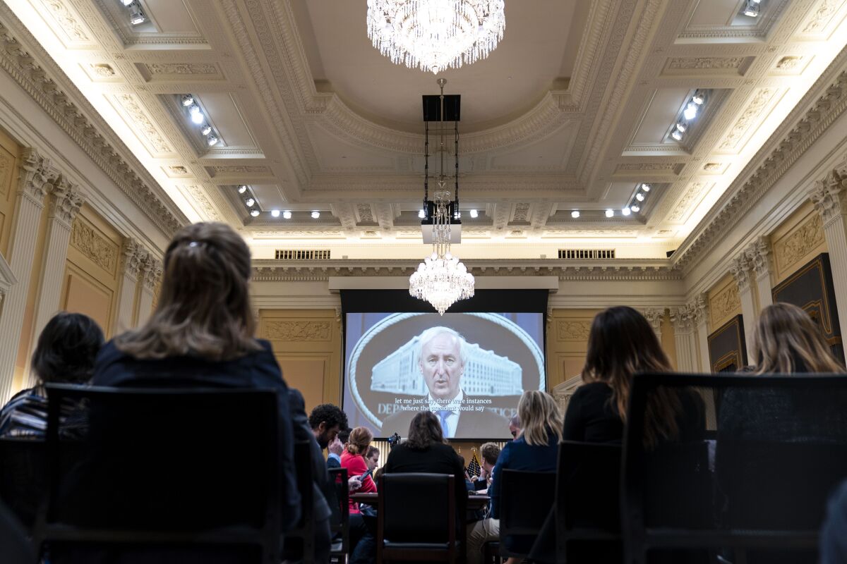 A video of former acting Attorney General Jeffrey Rosen is displayed during a House Select Committee hearing.