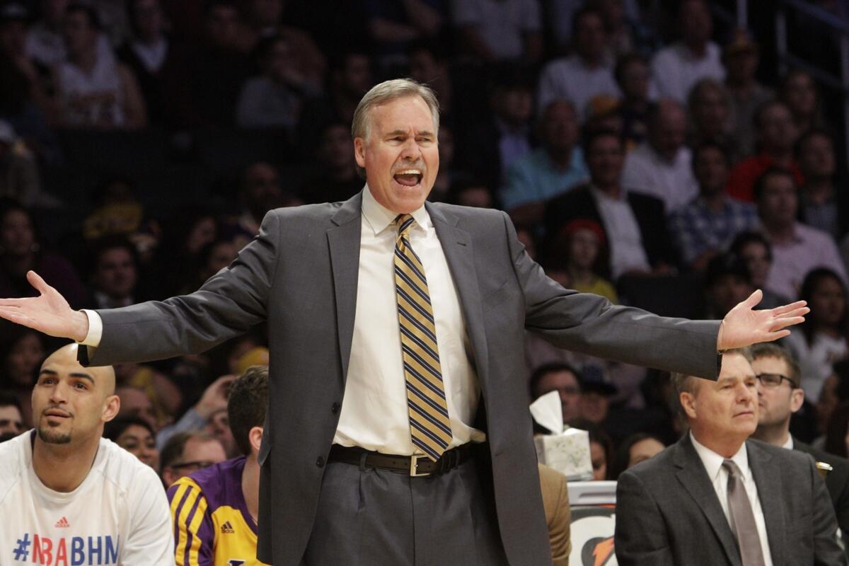 Coach Mike D'Antoni voices his frustration during the second half of the Lakers' 96-79 loss Tuesday to the Utah Jazz at Staples Center.