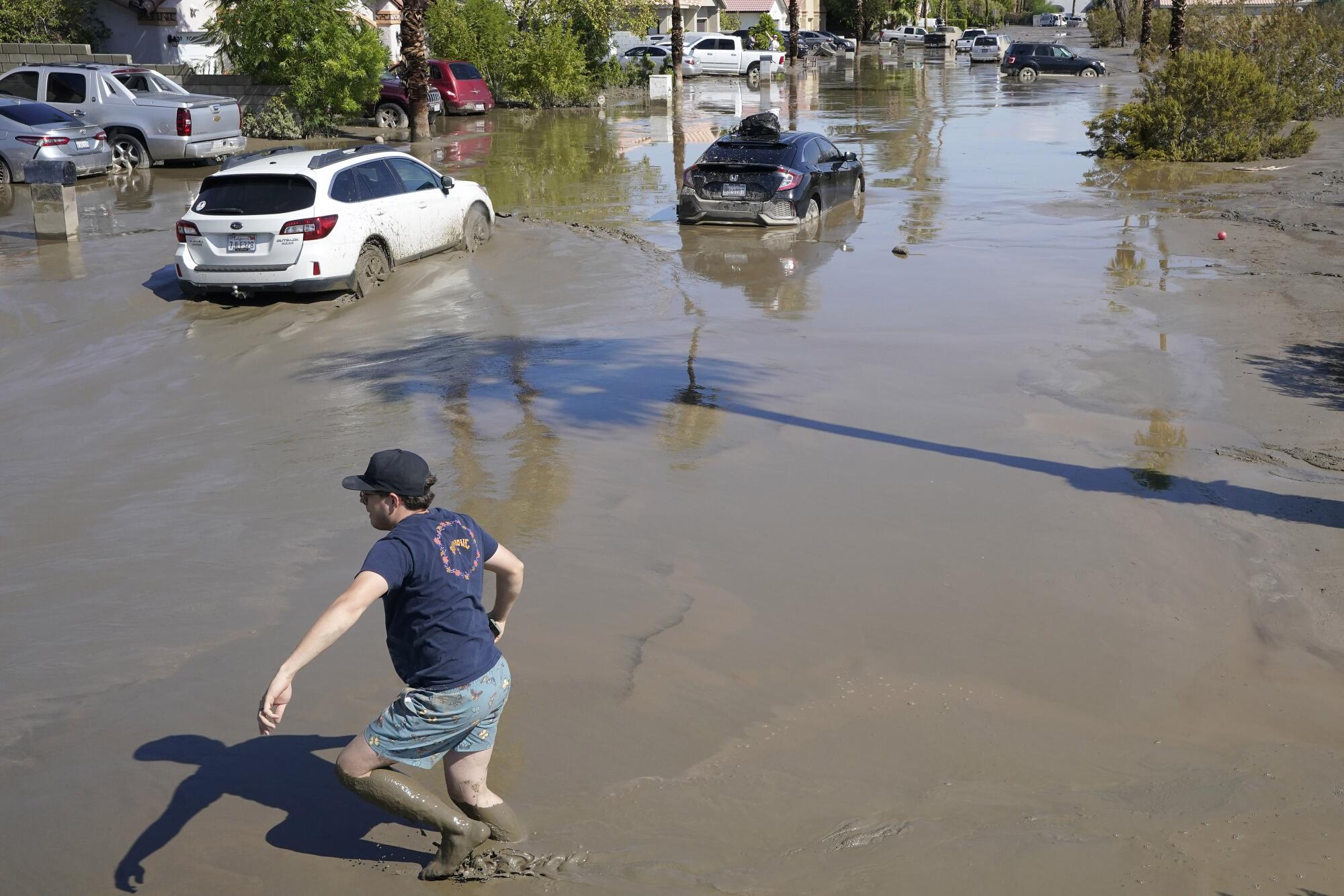 Cars are seen stuck in the mud in Cathedral City, Calif. 