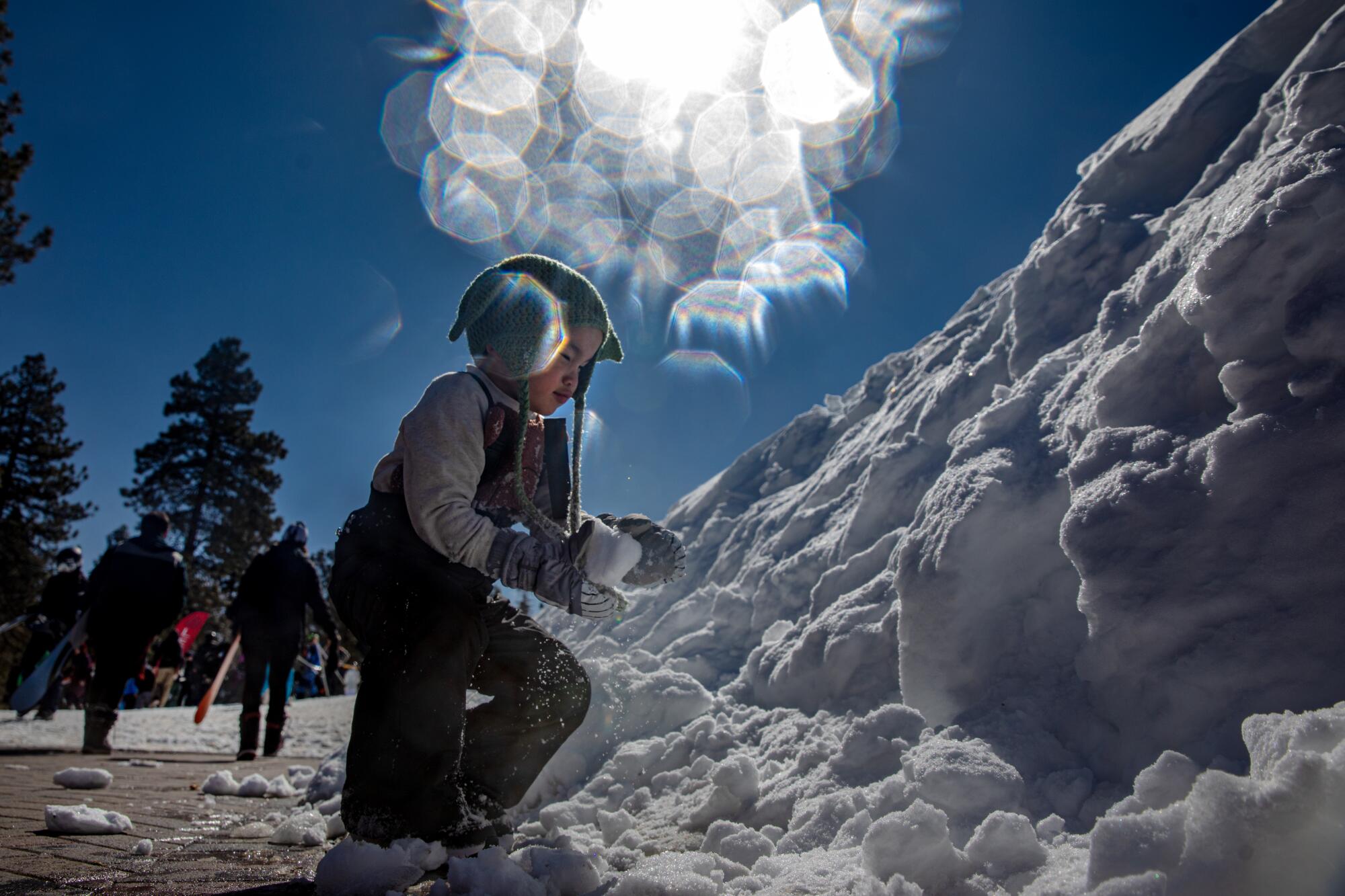 A child plays in the snow at Big Bear Mountain Resort.