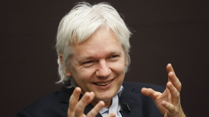WikiLeaks founder Julian Assange gestures as he speaks during a news conference in London, England on Dec. 1, 2011.
