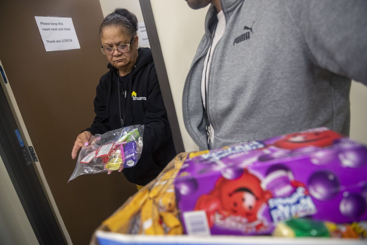Odessa Henderson helps pack kits for homeless people