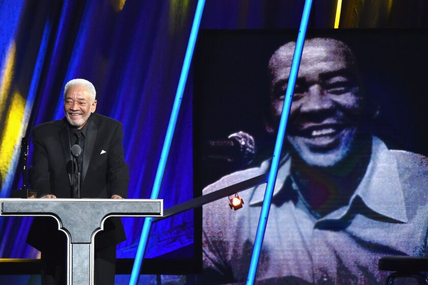 Bill Withers speaks at his induction into the Rock and Roll Hall of Fame.
