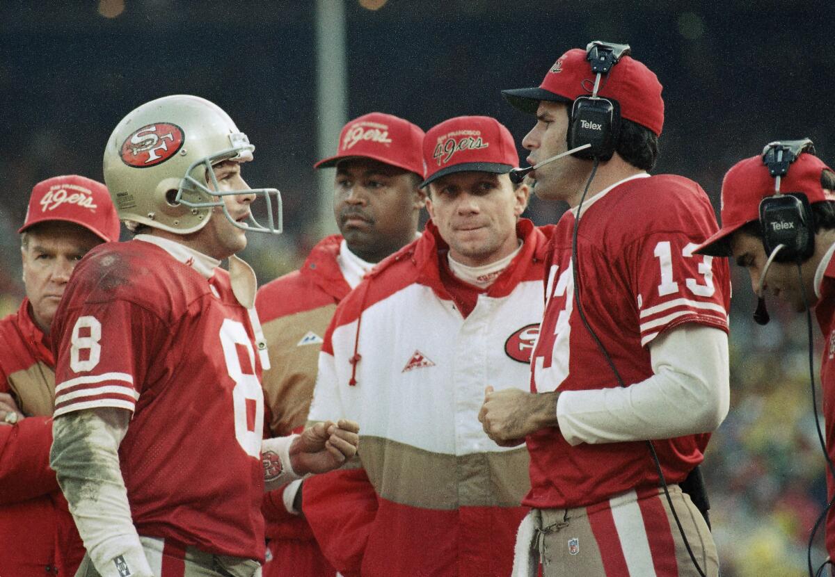 Steve Young (8), Steve Bono (13) and Joe Montana, center, were all on the 49ers in 1987.