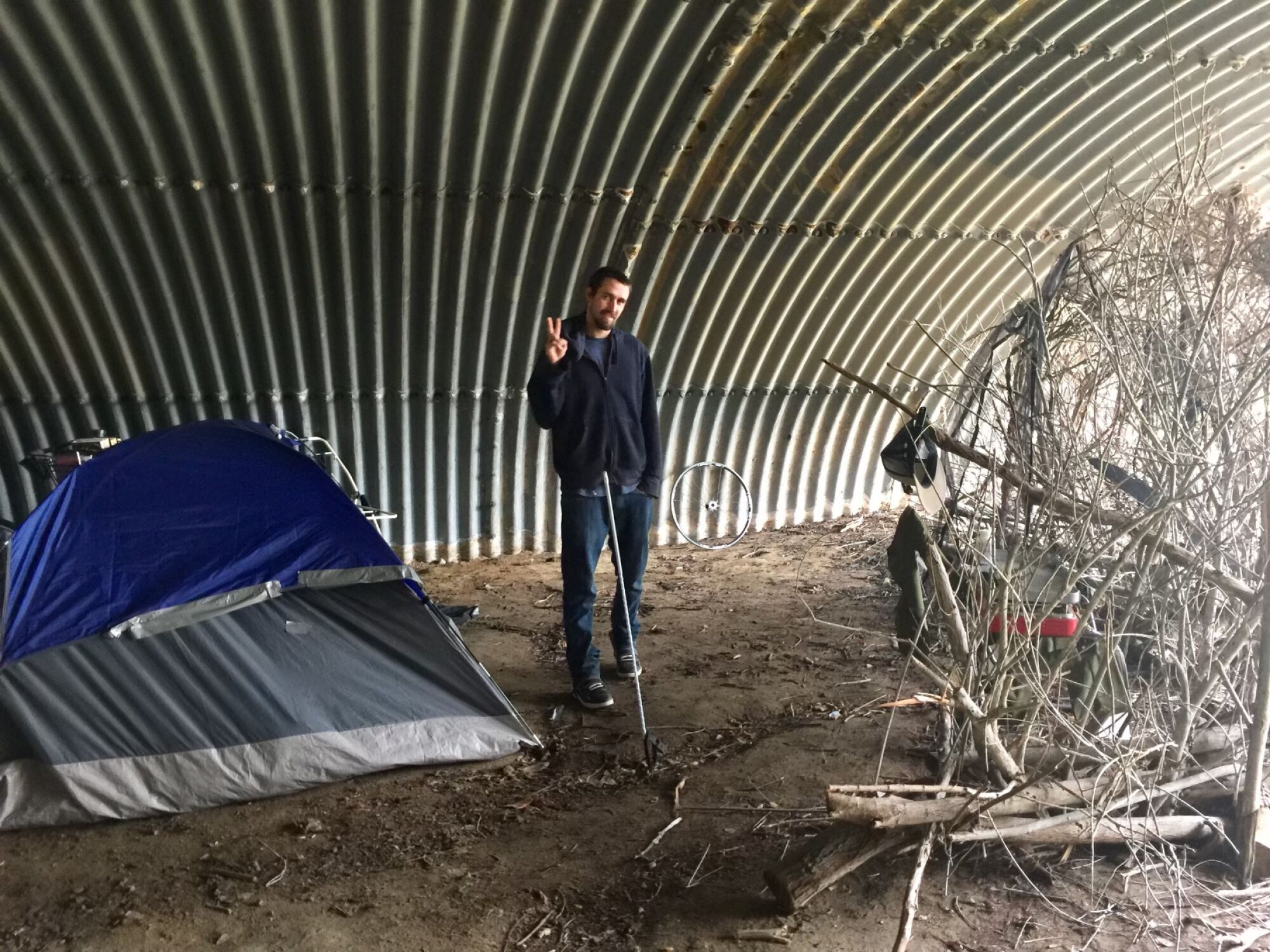 Luke Locatell next to his tent in Encinitas.