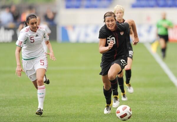 Abby Wambach (righ) against Natalie Vinti of Mexico during the USA-Mexico friendly match.