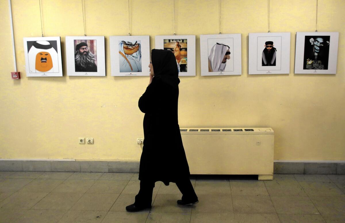 Cartoons are displayed as part of the Daesh International Cartoon and Caricature Contest in Tehran.