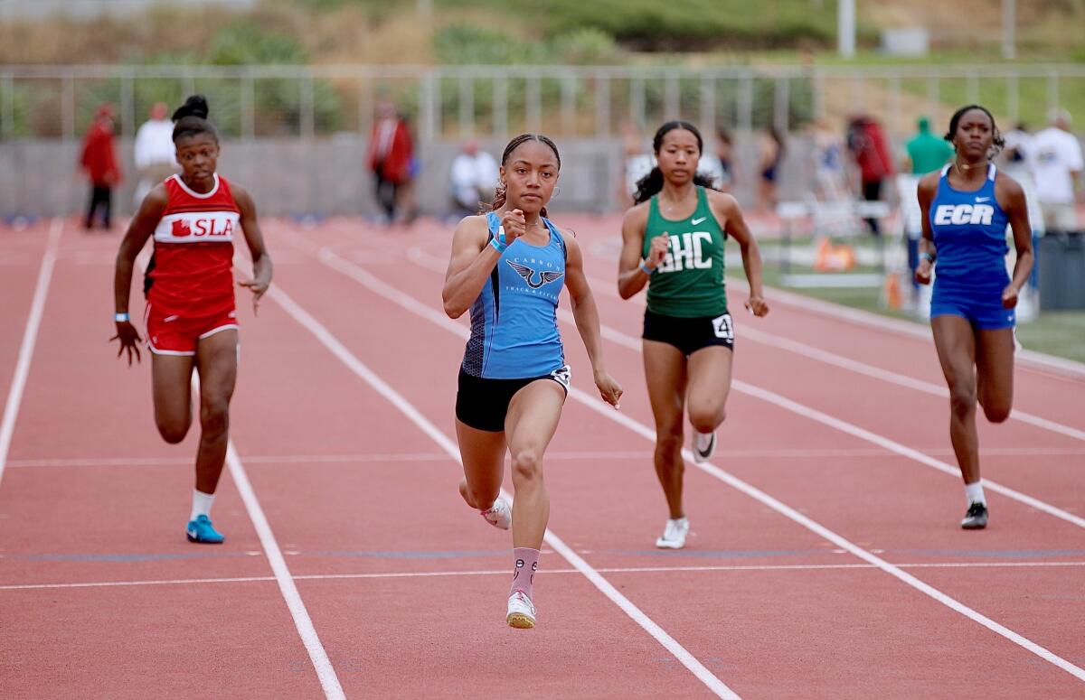 Carson sophomore Christina Gray finishes in 11.86 seconds for the fastest time in the girls' 100 meters.