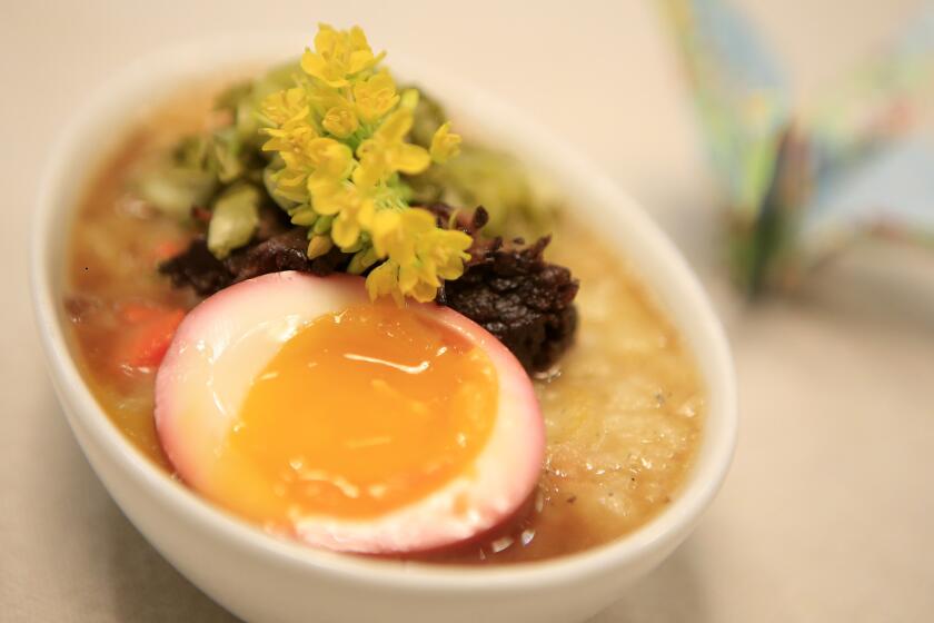 The short rib porridge includes kokuho heirloom rice, braised beef short ribs, lacto-fermented mustard greens, pickled egg, pickled pears and herbs.