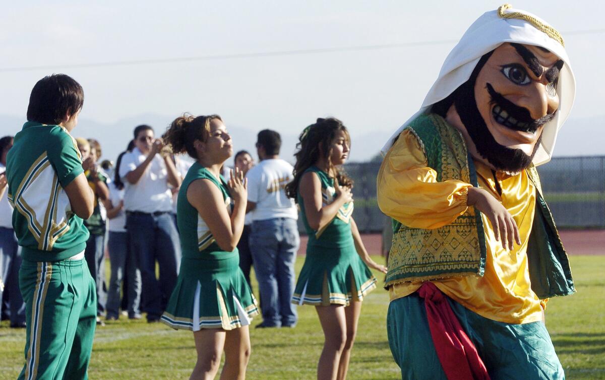 In this Nov. 10, 2005, photo, Coachella Valley High School's mascot, the "Arab," dances during a pep rally at the school in Thermal, Calif.