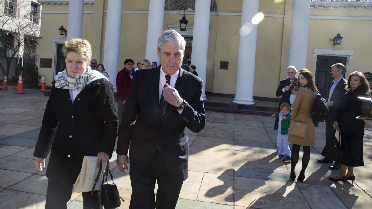 Special counsel Robert S. Mueller III walks with his wife, Ann, on Sunday after leaving church services near the White House.