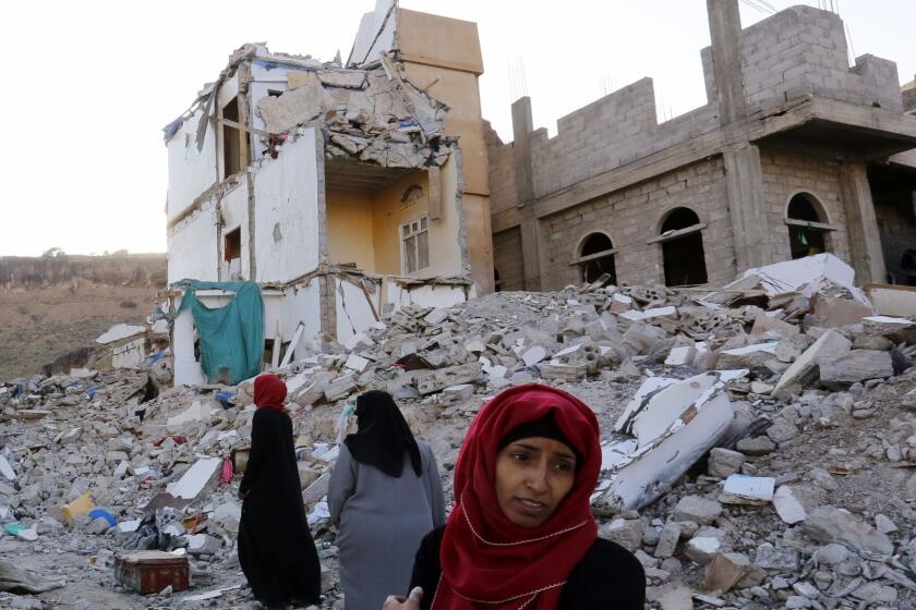 Mandatory Credit: Photo by YAHYA ARHAB/EPA-EFE/REX/Shutterstock (9100071d) Yemeni women walk through the debris of a housing block allegedly destroyed by previous Saudi-led airstrikes, in Sana?a, Yemen, 29 September 2017. According to reports, the UN Human Rights Council has agreed to establish a group of eminent experts to carry out a comprehensive examination of all alleged war crimes and human rights violations committed in Yemen amid the ongoing conflict between the Saudi-led military coalition and the Houthi rebels. UN war crimes investigators to be sent to Yemen, Sana'a - 29 Sep 2017 ** Usable by LA, CT and MoD ONLY **