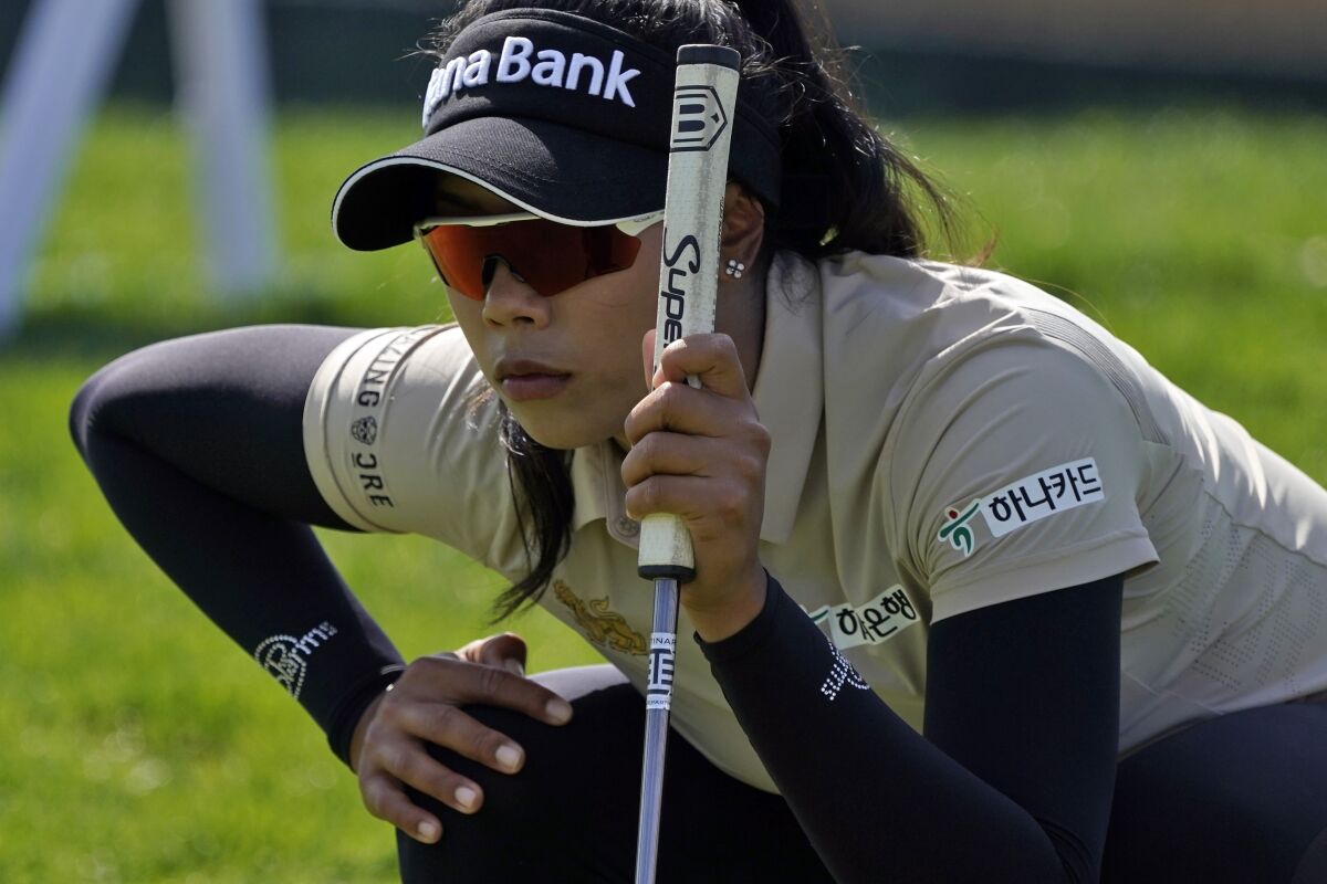 Patty Tavatanakit lines up her putt on the eighth hole during the third round of the Chevron Championship on April 2, 2022.