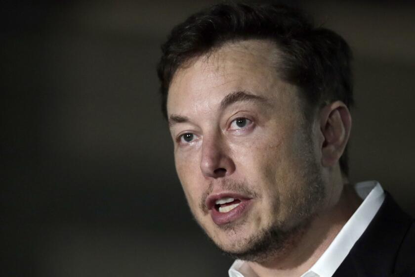 FILE - In a Thursday, June 14, 2018 file photo, Tesla CEO and founder of the Boring Company Elon Musk speaks at a news conference, in Chicago. Whether itâs investors betting against his stock, reporters or analysts who ask tough questions or a union trying to organize his workers, Elon Musk has fought back, often around the clock on Twitter. But when Musk called a British diver involved in the Thailand cave rescue a pedophile to 22.3 million Twitter followers on July 15, he may have gone one tweet too far. (AP Photo/Kiichiro Sato, File)