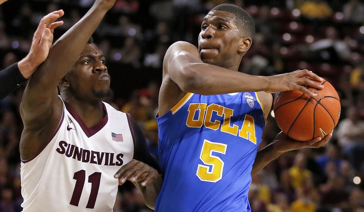 UCLA and forward Kevon Looney, who is driving to the basket against Arizona State's Savon Goodman, face a big task when playing No. 7 Arizona on Saturday.