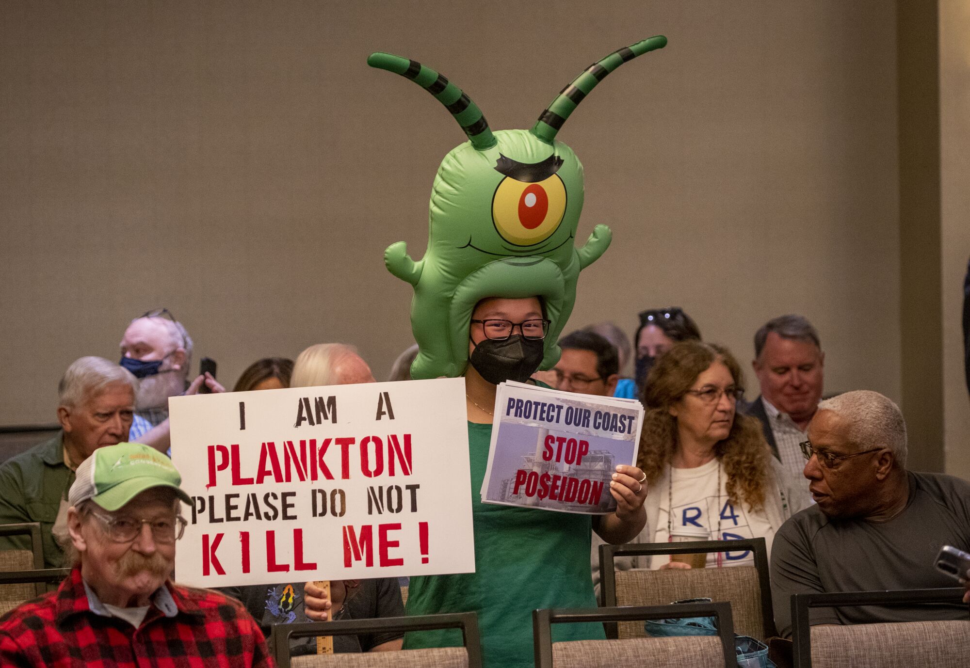 Zoey Lambe-Hommel attends the California Coastal Commission hearing in Costa Mesa, where the project was rejected.