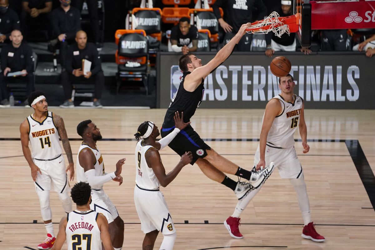 Clippers center Ivica Zubac dunks against the Denver Nuggets.