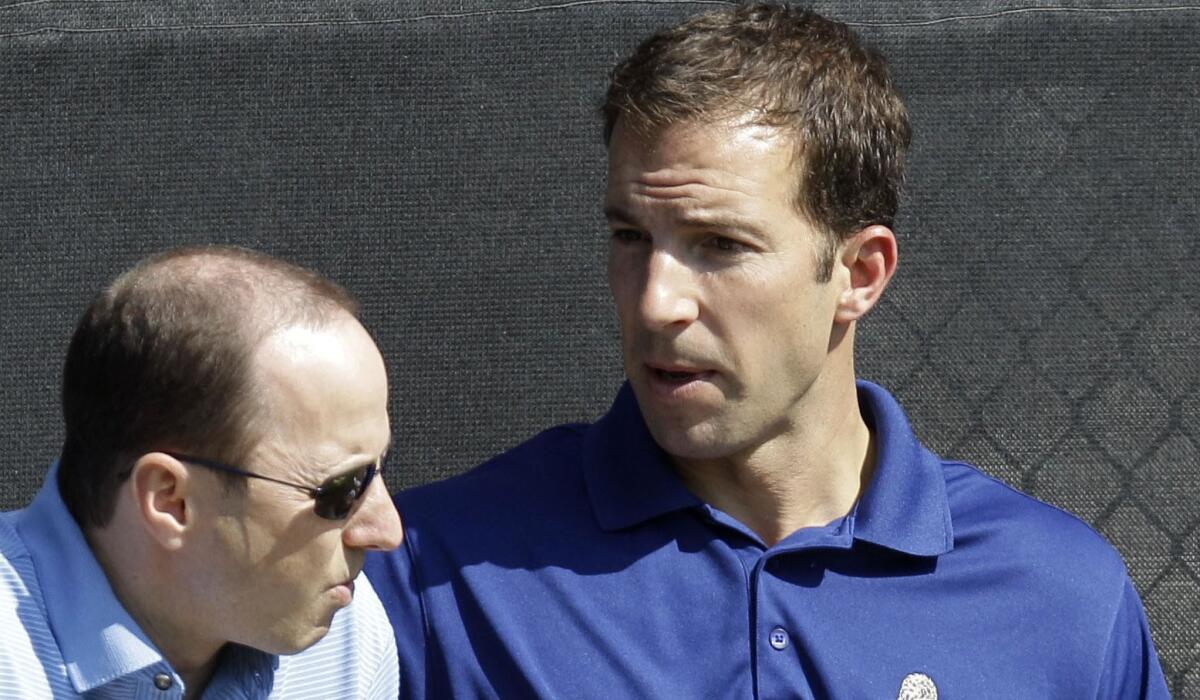 Billy Eppler, right, sits with New York Yankees General Manager Brian Cashman in 2011.